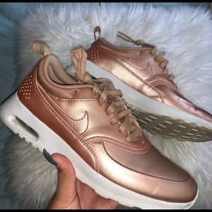 Nike thea rose gold kicks